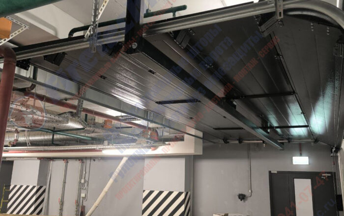 Секционные противопожарные ворота FireTechnics-S EI60 без калитки в паркинге ЖК